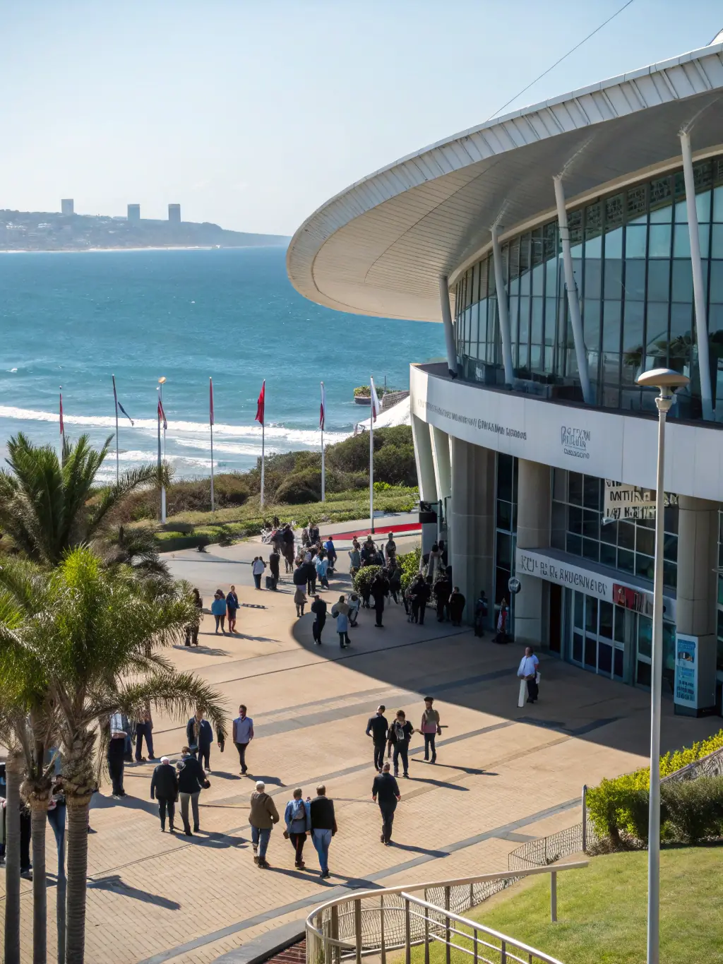 A photograph of the Sandton Convention Centre, Johannesburg, South Africa, during the Africa Tech Festival, showcasing a bustling environment with tech professionals and exhibitors.